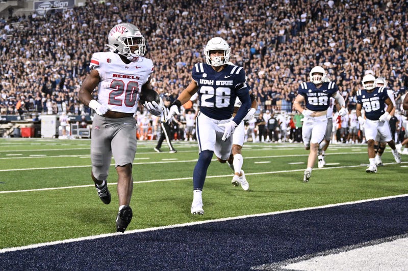 Hajj-Malik Williams threw three first-half touchdown passes, Kylin James ran for three TDs and UNLV erupted for 27 second-quarter points Friday night as the Runnin’ Rebels beat Utah State 50-34.