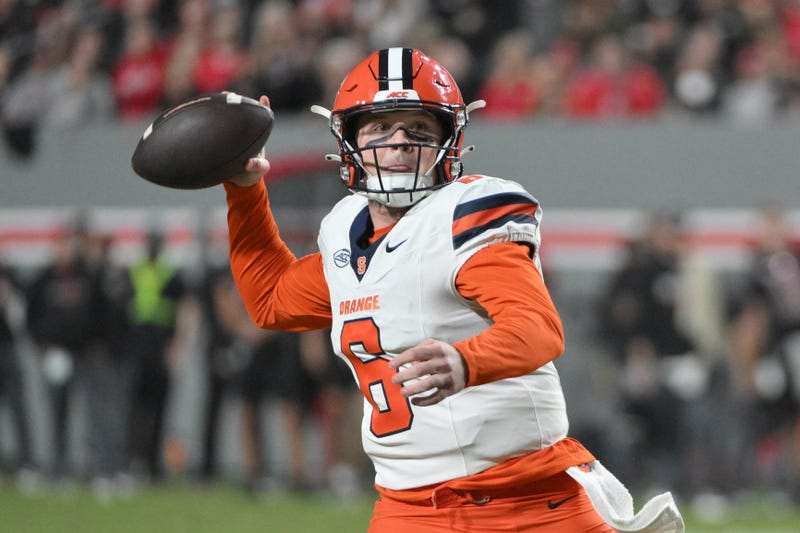 Kyle McCord throwing on the run