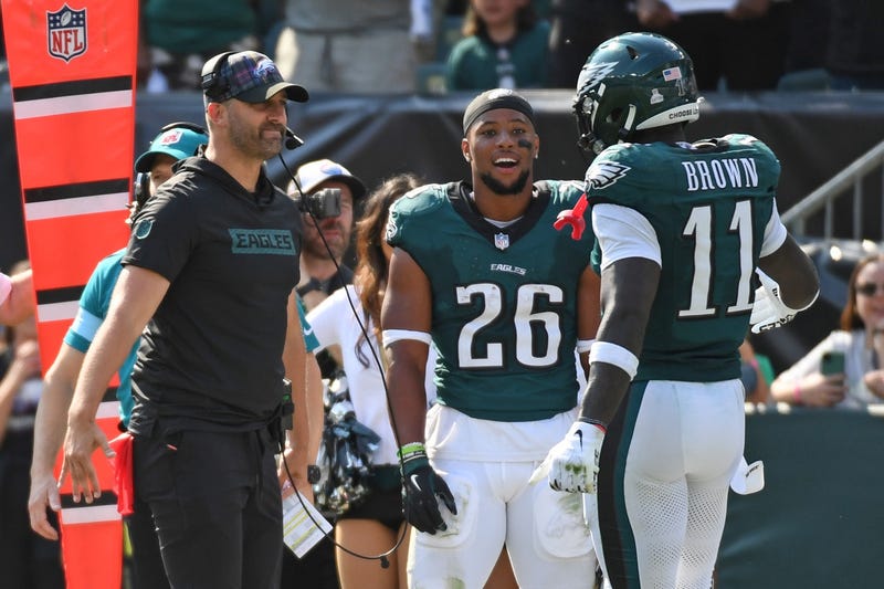 Philadelphia Eagles head coach Nick Sirianni and running back Saquon Barkley celebrate a touchdown catch by wide receiver A.J. Brown against the Cleveland Browns on Sunday.