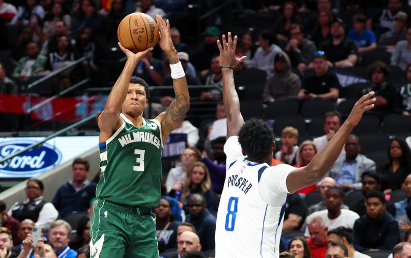 Oct 17, 2024; Dallas, Texas, USA; Milwaukee Bucks forward MarJon Beauchamp (3) shoots as Dallas Mavericks forward Olivier-Maxence Prosper (8) defends during the second half at American Airlines Center