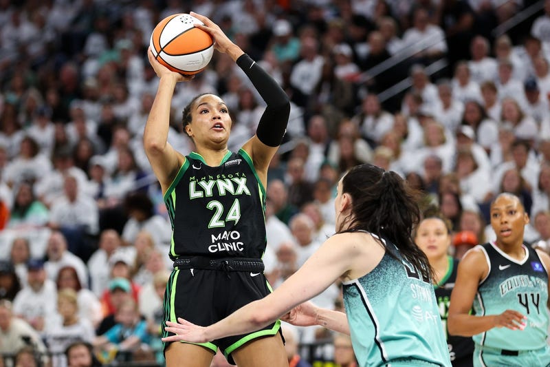 Lynx forward Napheesa Collier (24) shoots over New York Liberty forward Breanna Stewart (30) during the first half of game four of the 2024 WNBA Finals at Target Center.