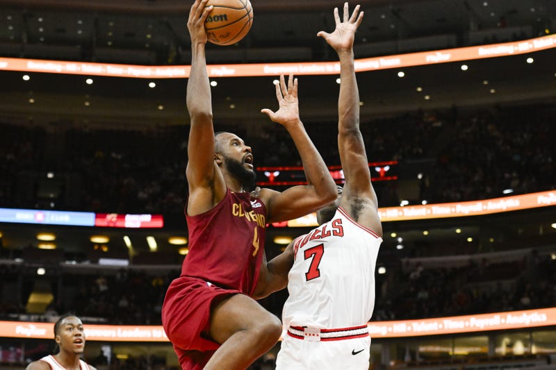 Oct 18, 2024; Chicago, Illinois, USA; Cleveland Cavaliers forward Evan Mobley (4) drives to the basket against Chicago Bulls guard Jalen Smith (7) during the second half at the United Center. 