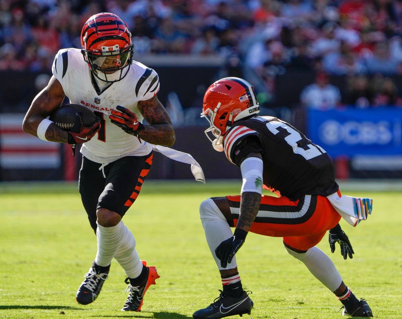 Cincinnati Bengals wide receiver Ja'Marr Chase (1) runs the ball past Cleveland Browns cornerback Denzel Ward (21) in the NFL Week 7 game at Huntington Bank Field in Cleveland October 20, 2024. The Bengals won 21-14.