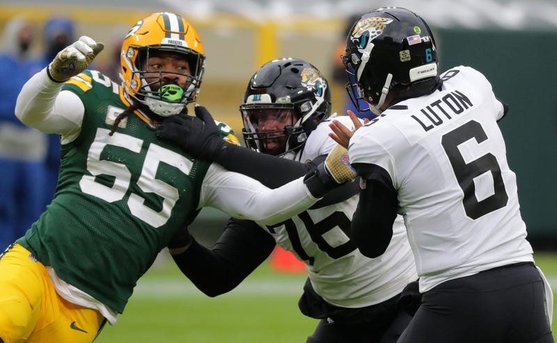 Green Bay Packers outside linebacker Za'Darius Smith (55) pressures Jacksonville Jaguars quarterback Jake Luton (6) during the fourth quarter of their game at Lambeau Field in Green Bay, Wis. The Packers beat the Jaguars 24-20.