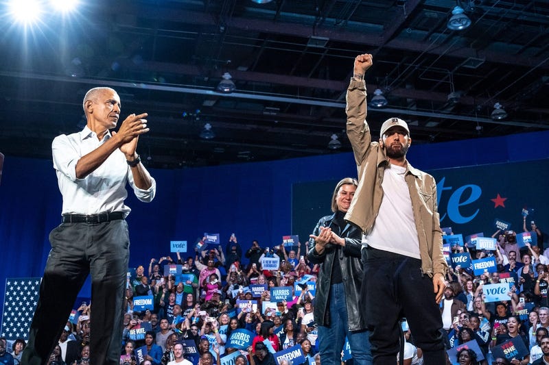 Former president Barack Obama cheers on Eminem after he introduced him
