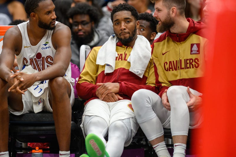 Cleveland Cavaliers guard Donovan Mitchell (45) reacts on the bench with forward Evan Mobley (4)