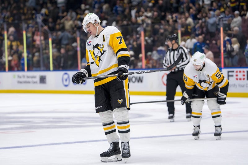 Evgeni Malkin and Kris Letang with heads down