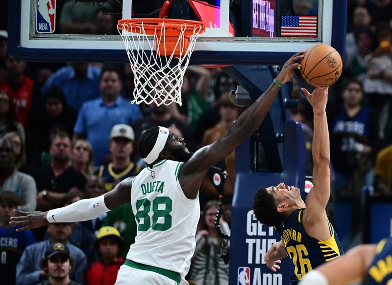 Boston Celtics center Neemias Queta (88) blocks a shot by Indiana Pacers guard Ben Sheppard (26) during the fourth quarter at Gainbridge Fieldhouse