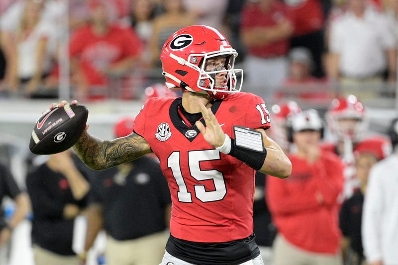 Georgia Bulldogs quarterback Carson Beck (15) passes the ball against the Florida Gators during the fourth quarter at EverBank Stadium.