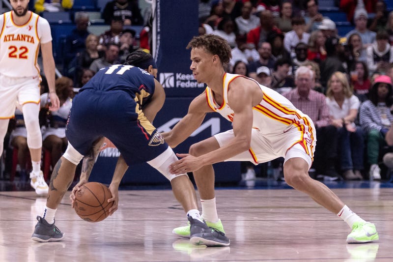 Nov 3, 2024; New Orleans, Louisiana, USA; Atlanta Hawks guard Dyson Daniels (5) attempts to steal the ball from New Orleans Pelicans guard Brandon Boston Jr. (11) during the first half at Smoothie King Center. Mandatory Credit: Stephen Lew-Imagn Images
