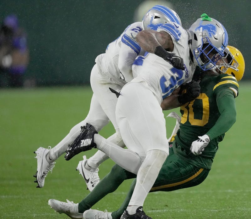 Detroit Lions safety Brian Branch (32) hits Green Bay Packers wide receiver Bo Melton (80) during the first quarter of their game Sunday, November 3, 2024 at Lambeau Field in Green Bay, Wisconsin. Branch was ejected from the game because of the hit.