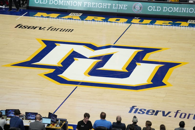 Nov 4, 2024; Milwaukee, Wisconsin, USA; General view of the Marquette Golden Eagles logo at center court during the game against the Stony Brook Seawolves at Fiserv Forum. Mandatory Credit: Jeff Hanisch-Imagn Images