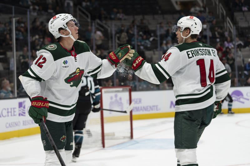Wild left wing Matt Boldy (12) celebrates with center Joel Eriksson Ek (14) during the third period against the San Jose Sharks at SAP Center at San Jose. 