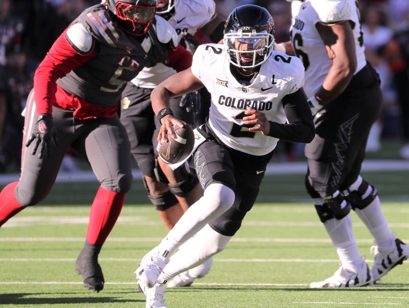 Shedeur Sanders running with football