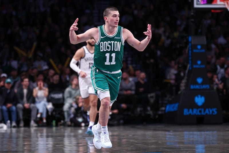 Boston Celtics guard Payton Pritchard (11) reacts after making a three point basket during the second half against the Brooklyn Nets at Barclays Center.