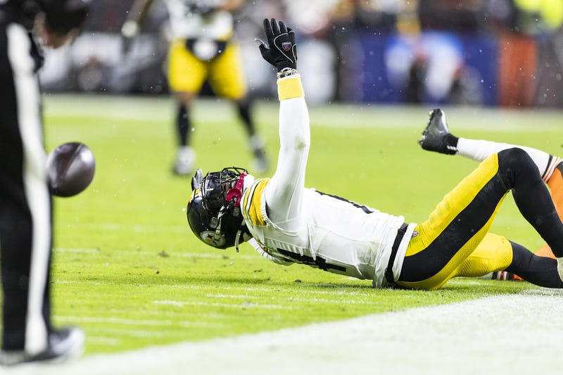George Pickens lying on the turf in Cleveland