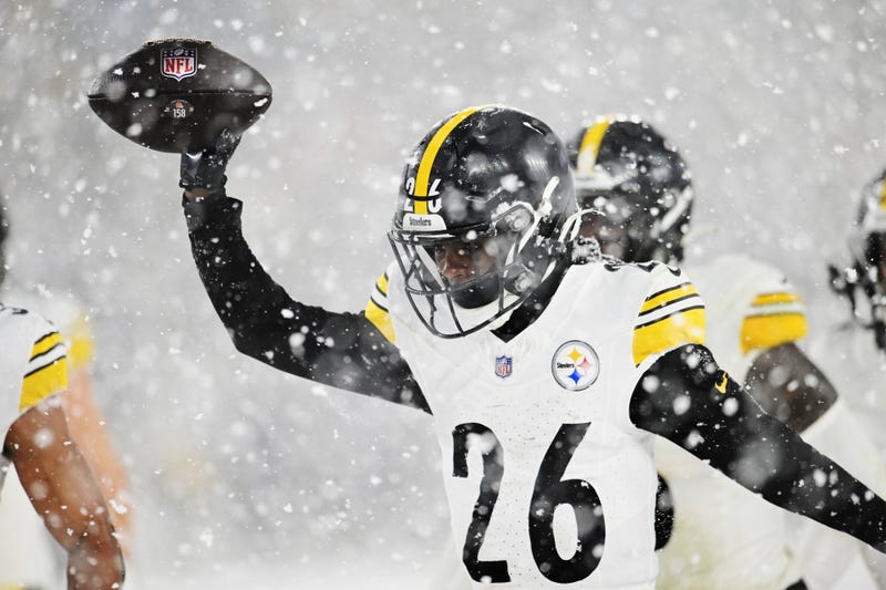 Donte Jackson with ball in snow