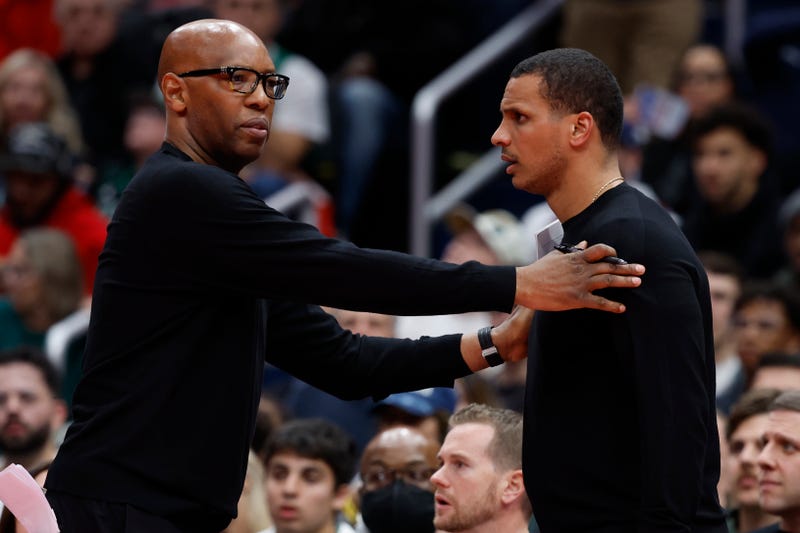 Boston Celtics head coach Joe Mazzulla is restrained by assistant coach Sam Cassell (L) after being assessed a technical foul against the Washington Wizards in the second half at Capital One Arena.