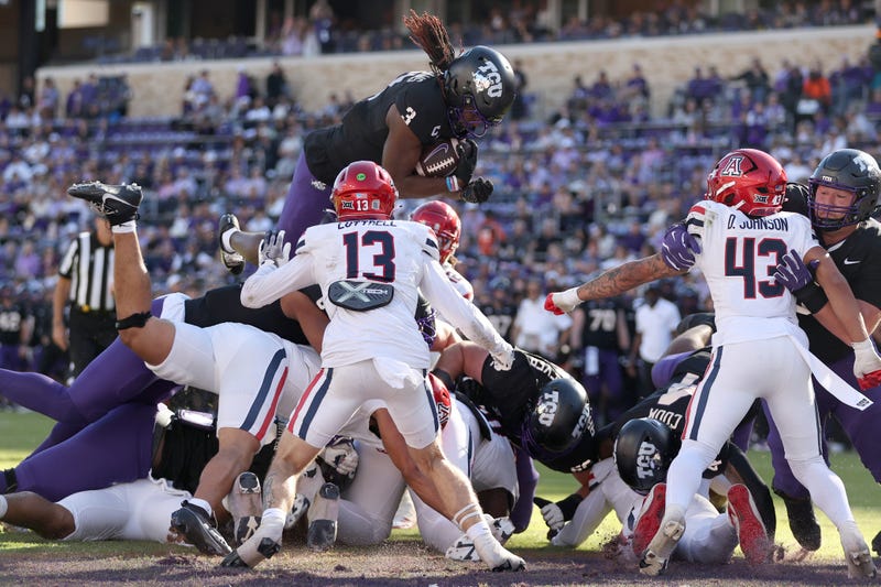 Nov 23, 2024; Fort Worth, Texas, USA; TCU Horned Frogs wide receiver Savion Williams (3) scores a touchdown against the Arizona Wildcats in the first quarter at Amon G. Carter Stadium. Mandatory Credit: Tim Heitman-Imagn Images