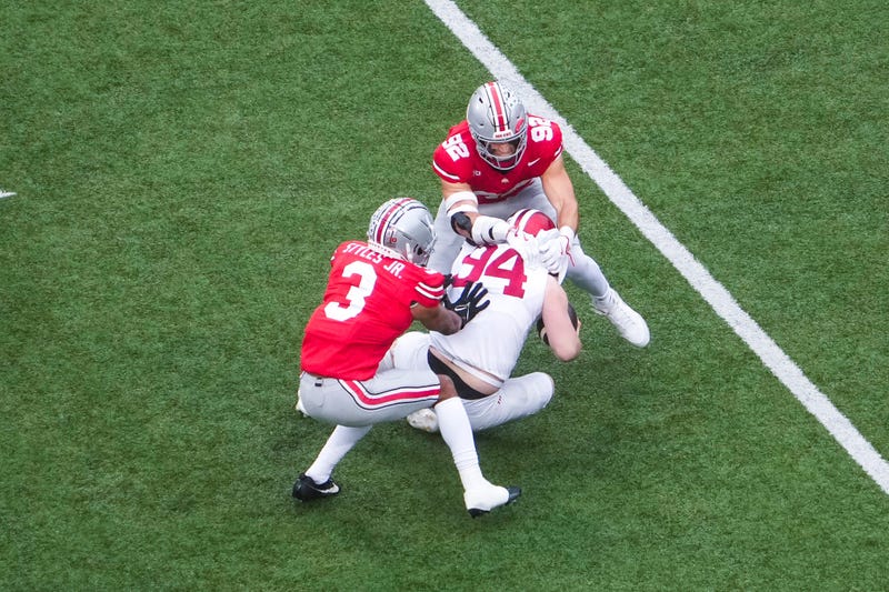 Ohio State Buckeyes defensive end Caden Curry (92) tackles Indiana Hoosiers punter James Evans (94) in the second quarter at Ohio Stadium on Saturday, Nov. 23, 2024 in Columbus, Ohio. © Samantha Madar/Columbus Dispatch / USA TODAY NETWORK via Imagn Images