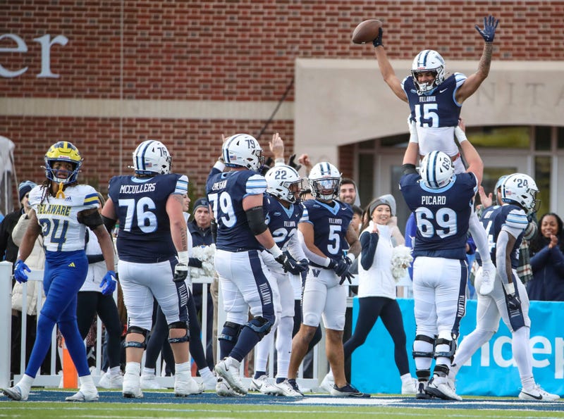 The Wildcats celebrate Kenyon Miles' touchdown reception in the second quarter at Villanova Stadium, Nov. 23, 2024.