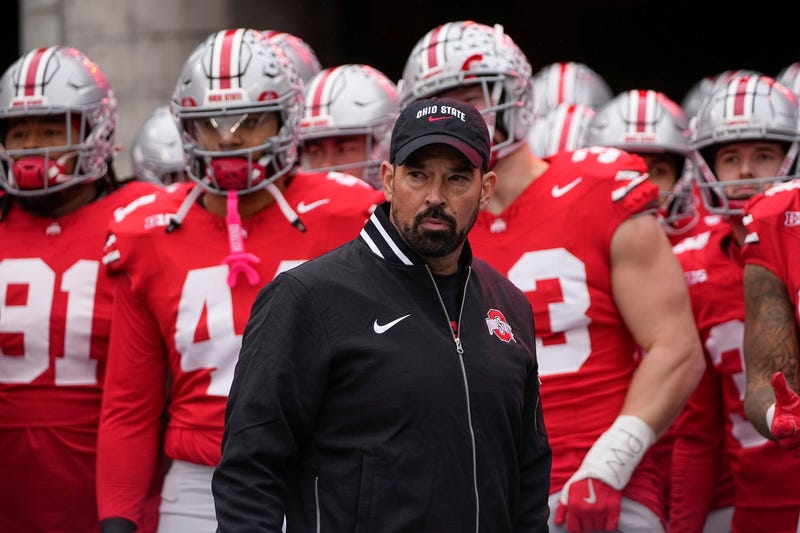 Ohio State Buckeyes head coach Ryan Day leads his team onto the field during the NCAA football game against the Indiana Hoosiers