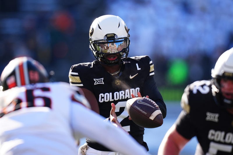 Nov 29, 2024; Boulder, Colorado, USA; Colorado Buffaloes quarterback Shedeur Sanders (2) takes a hike in the first quarter against the Oklahoma State Cowboys at Folsom F