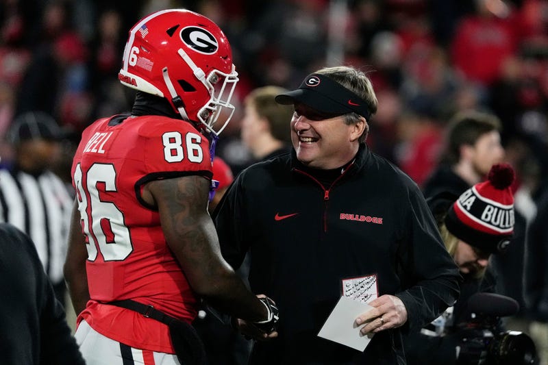 Georgia wide receiver Dillon Bell (86) speaks with Georgia coach Kirby Smart during warm ups before the start of a NCAA college football game against Georgia Tech in Athens, Ga., on Friday, Nov. 29, 2024.