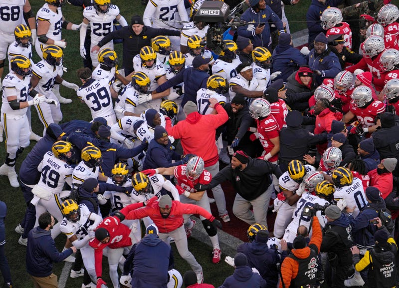 Nov 30, 2024; Columbus, Ohio, USA; Michigan Wolverines and Ohio State Buckeyes fight following the NCAA football game at Ohio Stadium in Columbus on Saturday, Nov. 30, 2024. Michigan won 13-10.