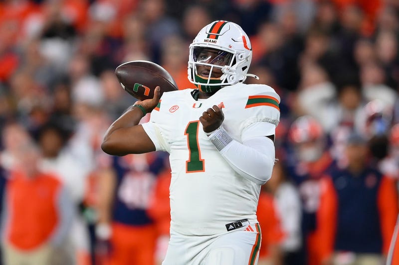 Nov 30, 2024; Syracuse, New York, USA; Miami Hurricanes quarterback Cam Ward (1) passes the ball against the Syracuse Orange during the first half at the JMA Wireless Dome. 