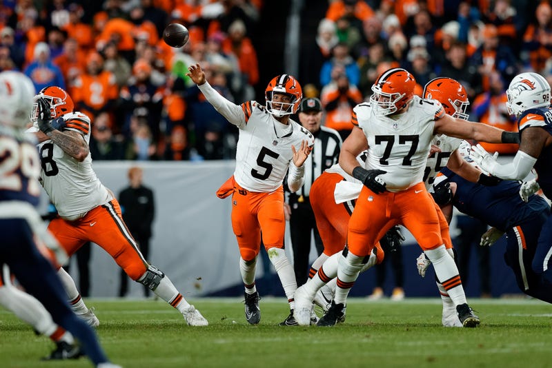 Cleveland Browns quarterback Jameis Winston (5) attempts a pass as guard Wyatt Teller (77) defends in the second quarter against the Denver Broncos at Empower Field at Mile High. 