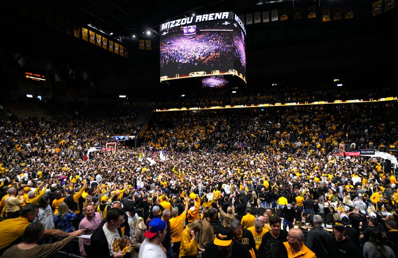 Dec 8, 2024; Columbia, Missouri, USA; Missouri Tigers fans storm the court after defeating the Kansas Jayhawks at Mizzou Arena. Mandatory Credit: Jay Biggerstaff-Imagn Images