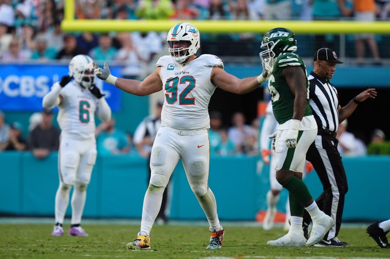Zach Sieler celebrates after sacking New York Jets quarterback Aaron Rodgers
