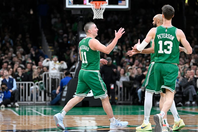 Boston Celtics guard Payton Pritchard (11) reacts to his three point basket against the Detroit Pistons during the second half at TD Garden.