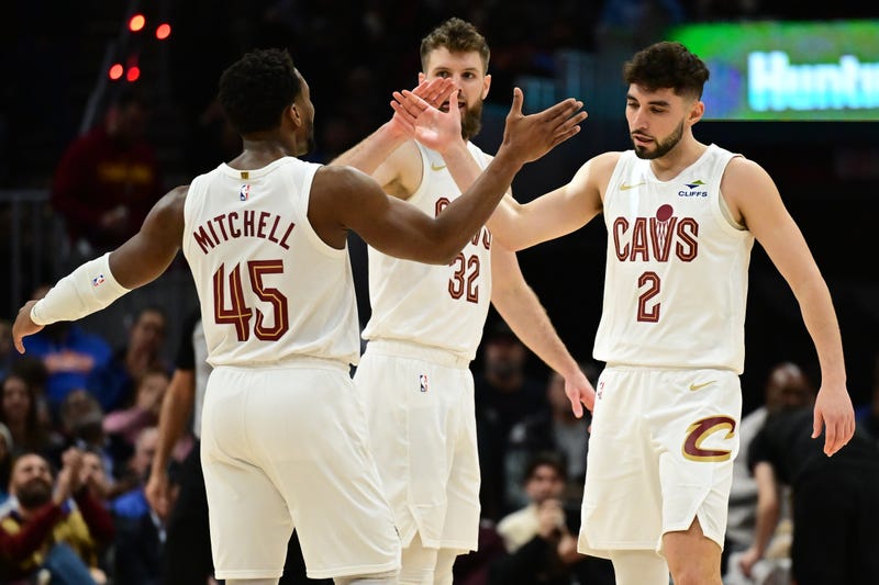 Dec 20, 2024; Cleveland, Ohio, USA; Cleveland Cavaliers guard Ty Jerome (2) celebrates with guard Donovan Mitchell (45) after hitting a three point basket during the first half against the Milwaukee Bucks at Rocket Mortgage FieldHouse.