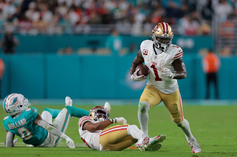 Deebo Samuel Sr. runs with the football against the Miami Dolphins during the fourth quarter at Hard Rock Stadium