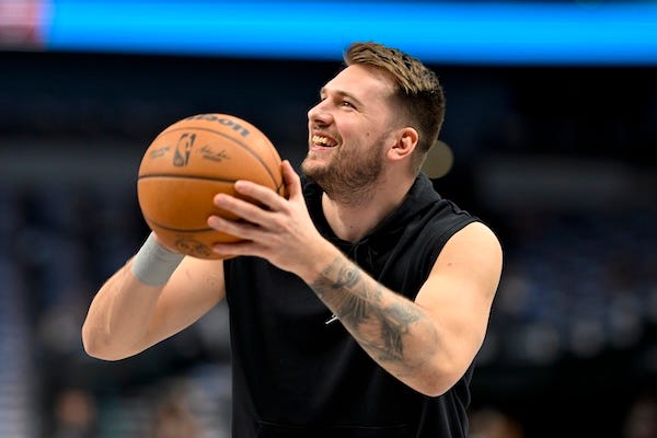 Dallas Mavericks guard Luka Doncic (77) warms up before the game between the Dallas Mavericks and the Portland Trail Blazers at the American Airlines Center