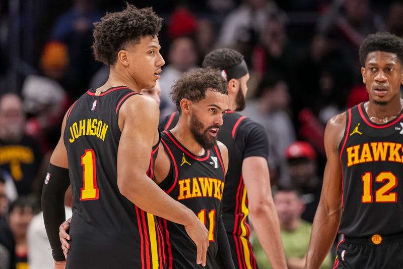 Dec 28, 2024; Atlanta, Georgia, USA; Atlanta Hawks guard Trae Young (11) reacts with forward Jalen Johnson (1) after the Hawks defeated the Miami Heat at State Farm Arena. Mandatory Credit: Dale Zanine-Imagn Images