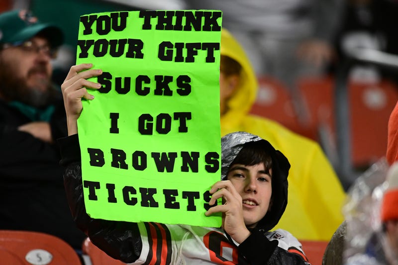 Dec 29, 2024; Cleveland, Ohio, USA; A Cleveland Browns fan holds a sign during the second half against the Miami Dolphins at Huntington Bank Field.