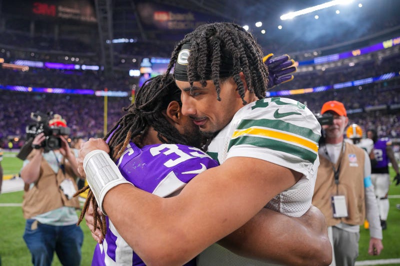 Dec 29, 2024; Minneapolis, Minnesota, USA; Green Bay Packers quarterback Jordan Love (10) and Minnesota Vikings running back Aaron Jones (33) hug after the game at U.S. Bank Stadium. Mandatory Credit: Brad Rempel-Imagn Images