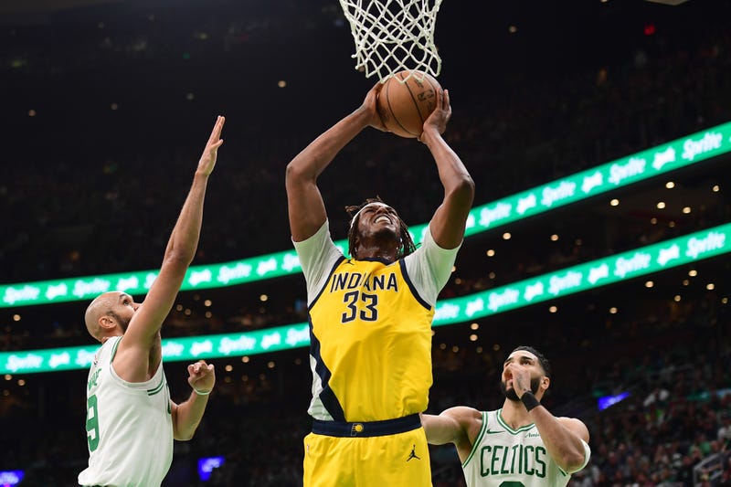 Boston, Massachusetts, USA; Indiana Pacers center Myles Turner (33) controls the ball while Boston Celtics guard Derrick White (9) and forward Jayson Tatum (0) defend during the second half at TD Garden.