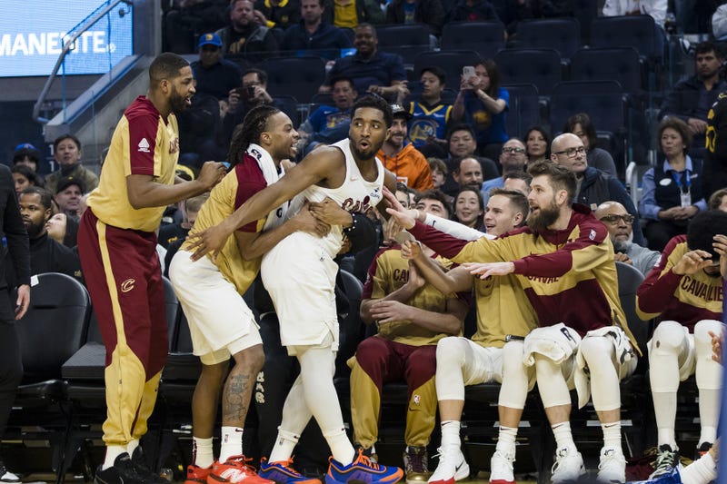 Dec 30, 2024; San Francisco, California, USA; Cleveland Cavaliers guard Donovan Mitchell (45) falls into the bench after colliding with a Golden State Warriors player during the second quarter at Chase Center. 