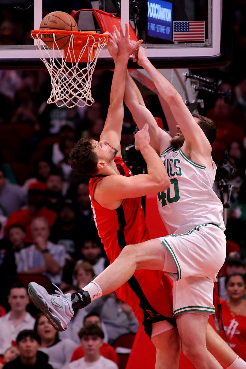 Boston Celtics center Luke Kornet (40) dunks against Houston Rockets center Alperen Sengun (28) during the first quarter at Toyota Center.