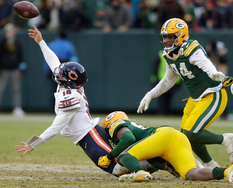 Green Bay Packers linebacker Edgerrin Cooper (56) wraps up Chicago Bears quarterback Caleb Williams (18) on Sunday, January 5, 2024 at Lambeau Field in Green Bay, Wis. The Bears defeated the Packers 24-22. Wm. Glasheen USA TODAY NETWORK-Wisconsin