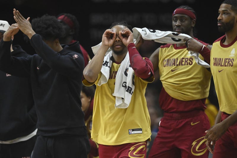 Jan 5, 2025; Cleveland, Ohio, USA; Cleveland Cavaliers guard Darius Garland (second from left) reacts in the second quarter against the Charlotte Hornets at Rocket Mortgage FieldHouse.