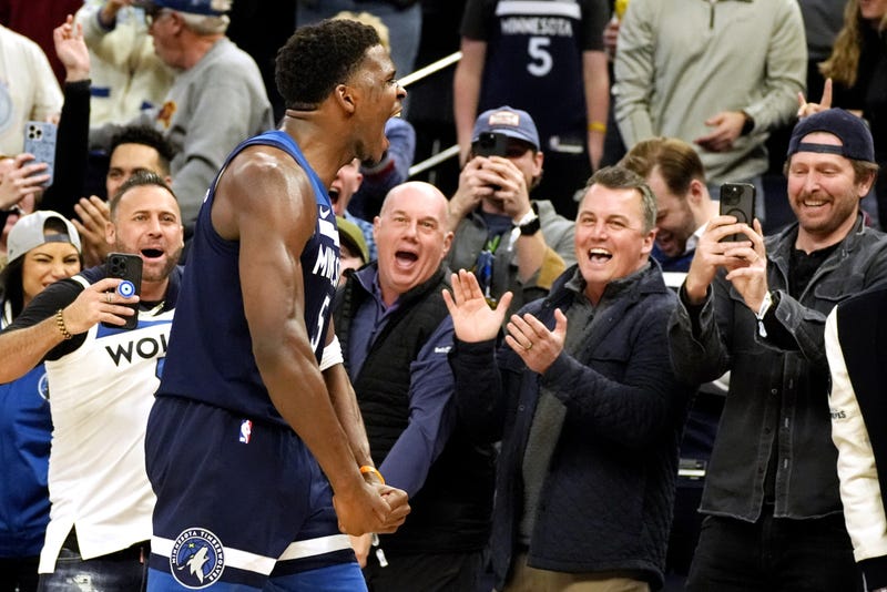 Timberwolves guard Anthony Edwards (5) celebrates his three-point basket against the Los Angeles Clippers late in the fourth quarter at Target Center.