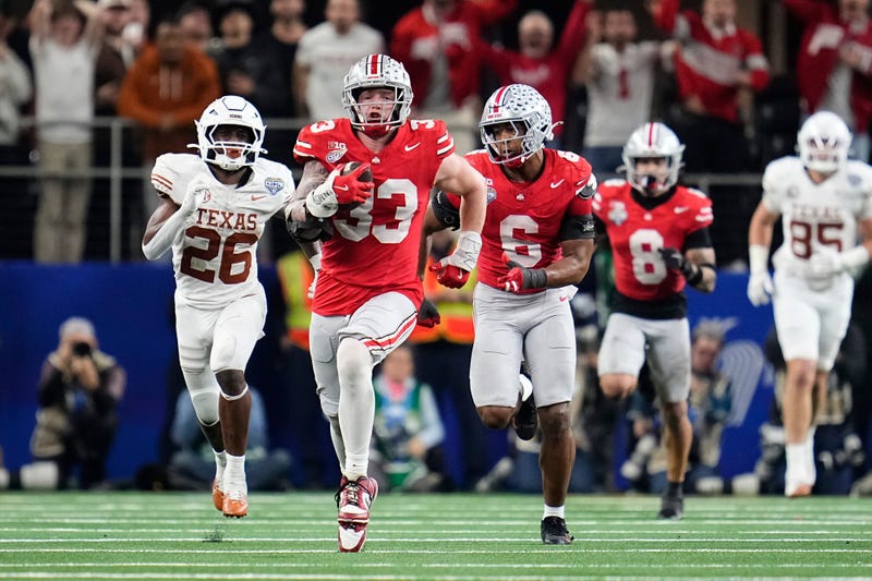 Ohio State Buckeyes defensive end Jack Sawyer (33) returns a fumble recovery for a touchdown after sacking Texas Longhorns quarterback Quinn Ewers