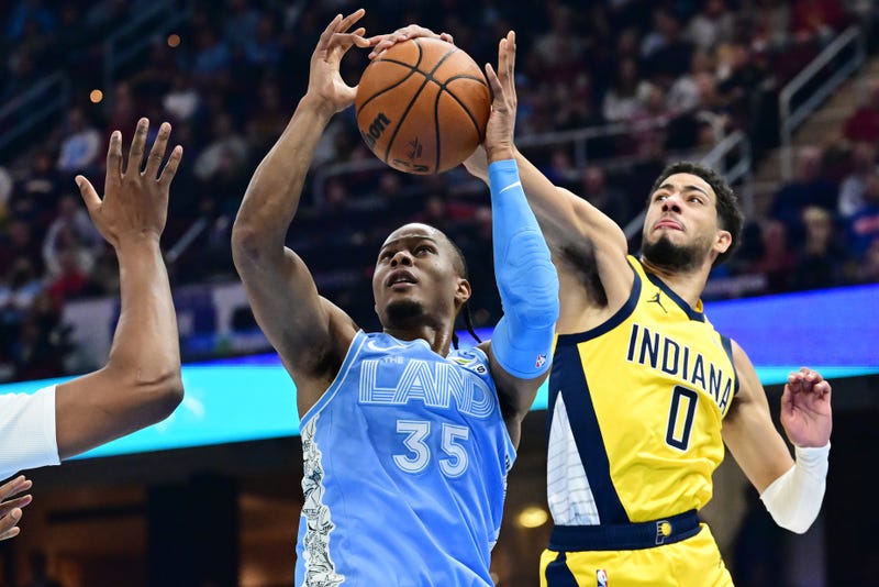 Jan 12, 2025; Cleveland, Ohio, USA; Indiana Pacers guard Tyrese Haliburton (0) blocks the shot of Cleveland Cavaliers forward Isaac Okoro (35) during the first half at Rocket Mortgage FieldHouse.