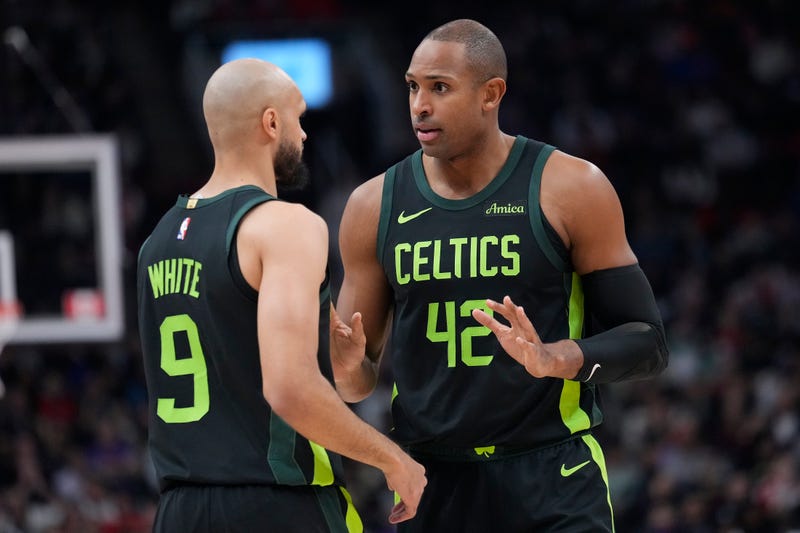 Boston Celtics center Al Horford (42) talks to guard Derrick White (9) during the first half against the Toronto Raptors at Scotiabank Arena.