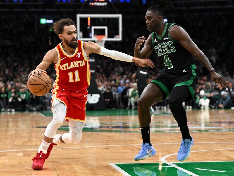 Atlanta Hawks guard Trae Young (11) drives to the basket against Boston Celtics guard Jrue Holiday (4) during the second quarter at the TD Garden.